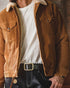 Tan corduroy barn jacket worn open over a white T-shirt and dark denim jeans with a black leather belt